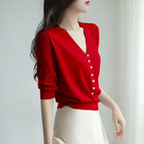 Short-Sleeved Ice Silk Knitted Women's 2026 Summer New Pearl Buckle Design Small Loose Thin Top