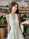French Gentle White Hanging Neck Sling Dress Women's Summer 2026 New Temperament Seaside Holiday Dress