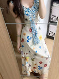 Lotus Leaf Fragmented Flower Sling Vacation Dress Women's Summer 2026 New Yunnan Sichuan West Tourism Gont Dress